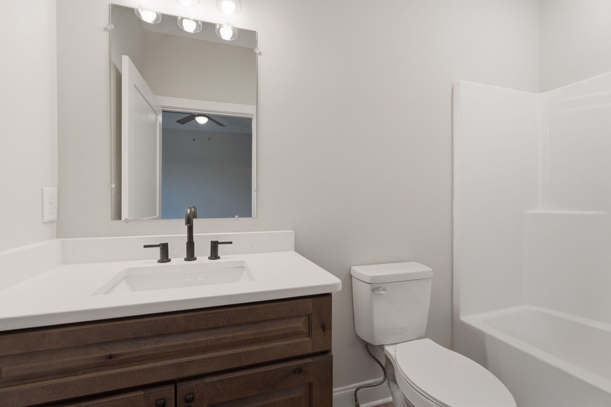 263 West Spring Street Smithville, TN 37166 - Photo 16 of 23 a bathroom with a sink toilet a mirror and shower