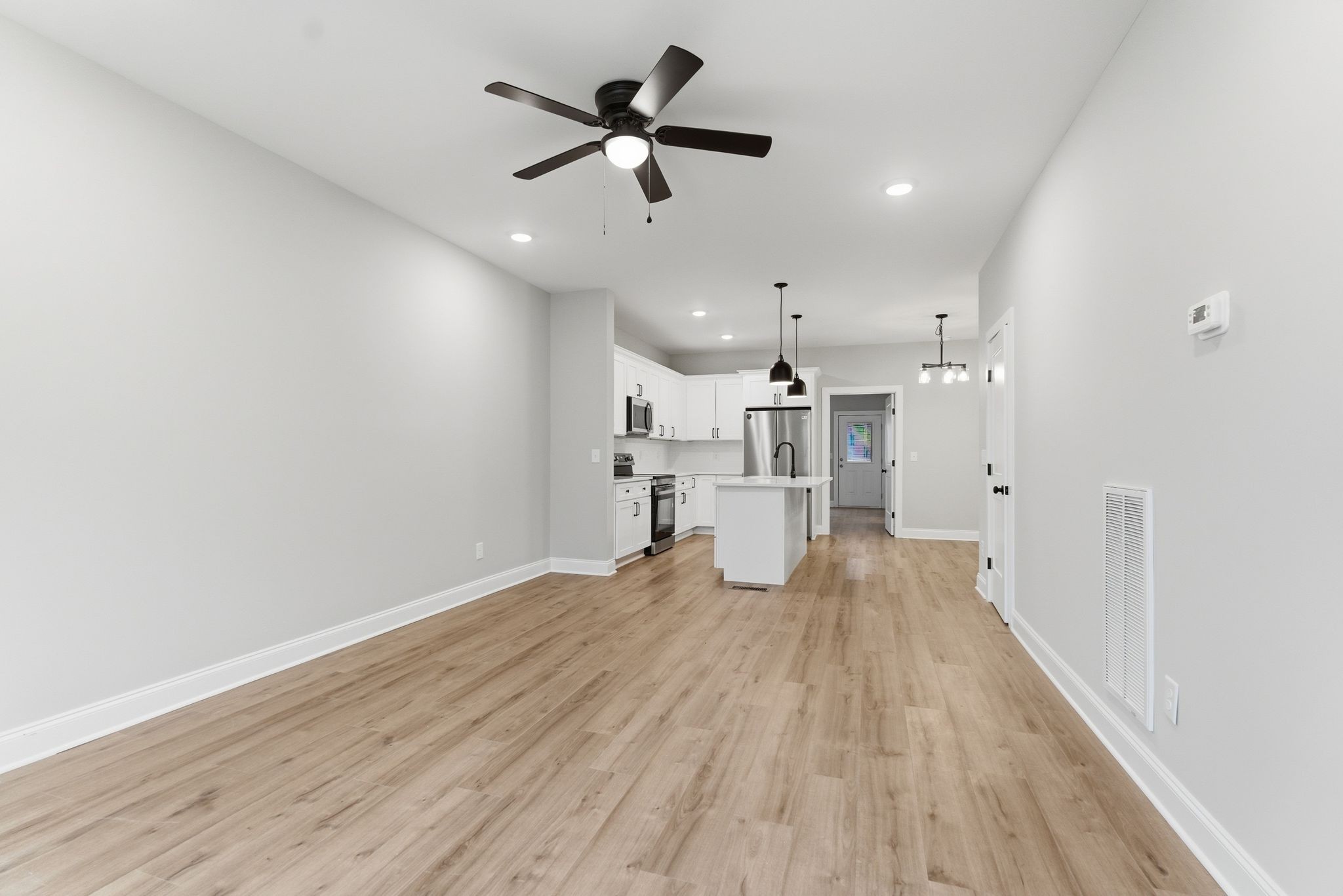 263 West Spring Street Smithville, TN 37166 - Photo 5 of 23 a view of a kitchen with a sink and wooden floor