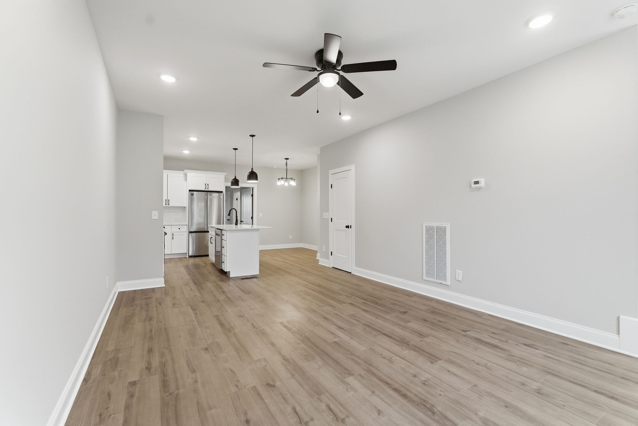 263 West Spring Street Smithville, TN 37166 - Photo 6 of 23 a view of empty room with wooden floor and window