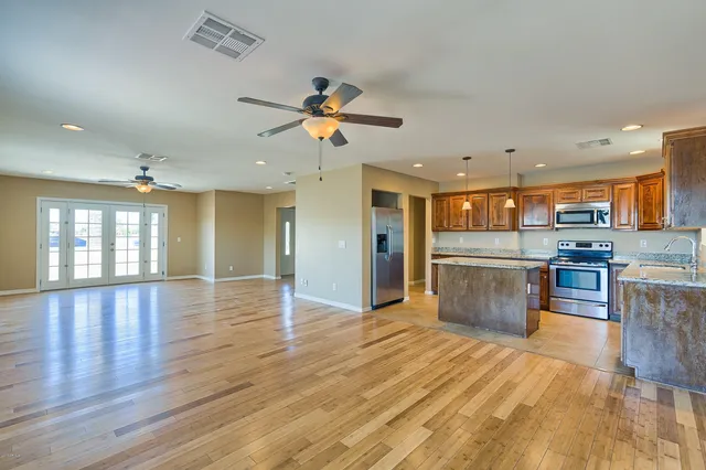 a view of kitchen with cabinets and wooden floor