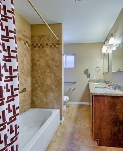 a bathroom with a bathtub and shower