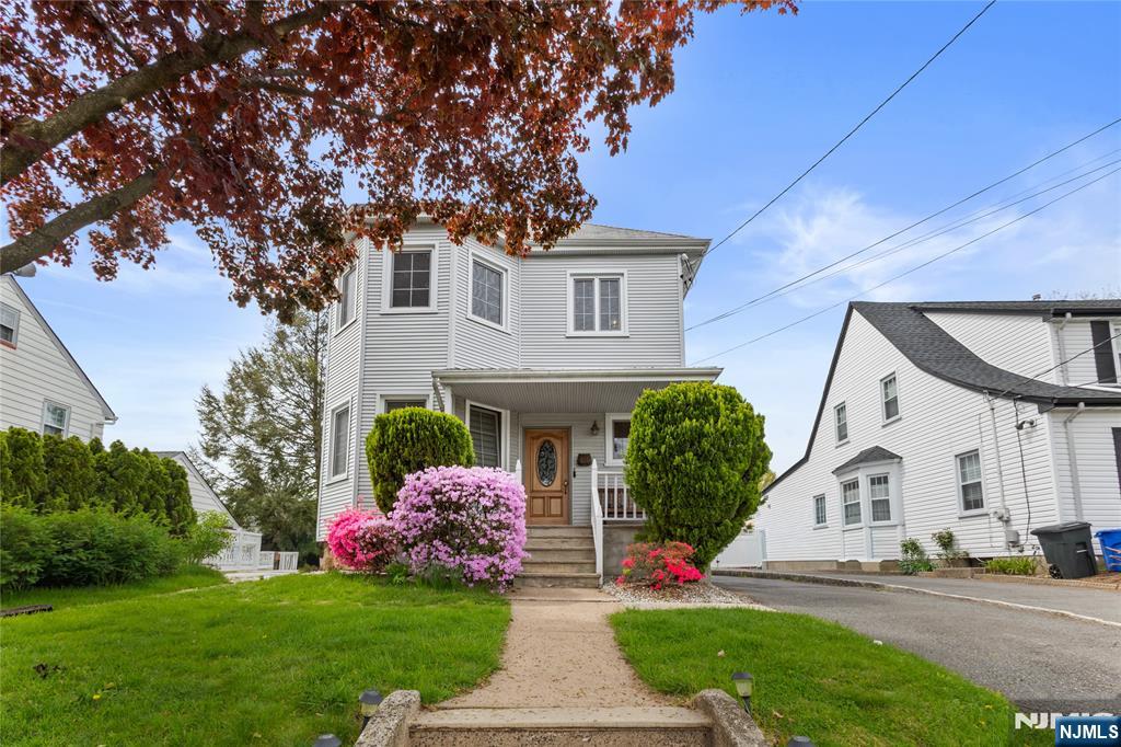 346 Cleveland Avenue, Unit 2 Hasbrouck Heights, NJ 07604 - Photo 2 of 39 a front view of a house with a yard