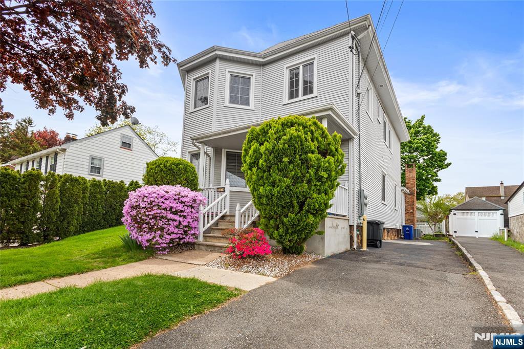 346 Cleveland Avenue, Unit 2 Hasbrouck Heights, NJ 07604 - Photo 3 of 39 a house view with a garden space