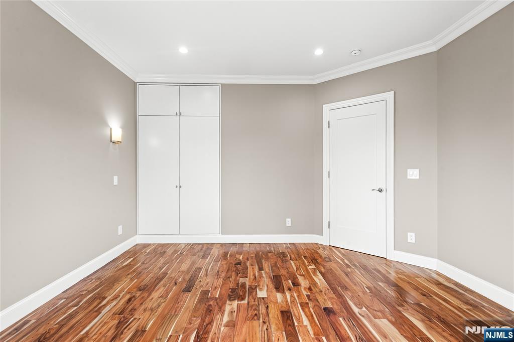 346 Cleveland Avenue, Unit 2 Hasbrouck Heights, NJ 07604 - Photo 33 of 39 a view of a room with wooden floor