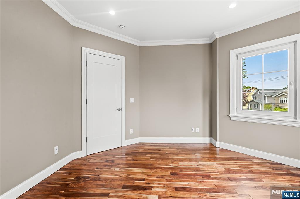 346 Cleveland Avenue, Unit 2 Hasbrouck Heights, NJ 07604 - Photo 34 of 39 a view of a room with wooden floor and window
