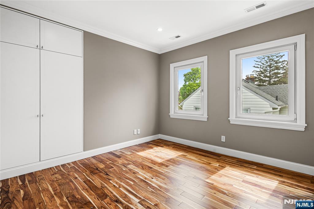 346 Cleveland Avenue, Unit 2 Hasbrouck Heights, NJ 07604 - Photo 36 of 39 a view of room with window and hallway