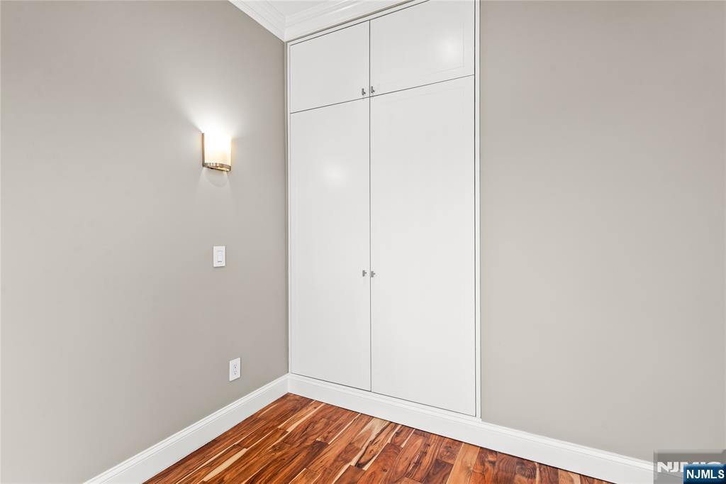 346 Cleveland Avenue, Unit 2 Hasbrouck Heights, NJ 07604 - Photo 37 of 39 a view of a room with wooden floor