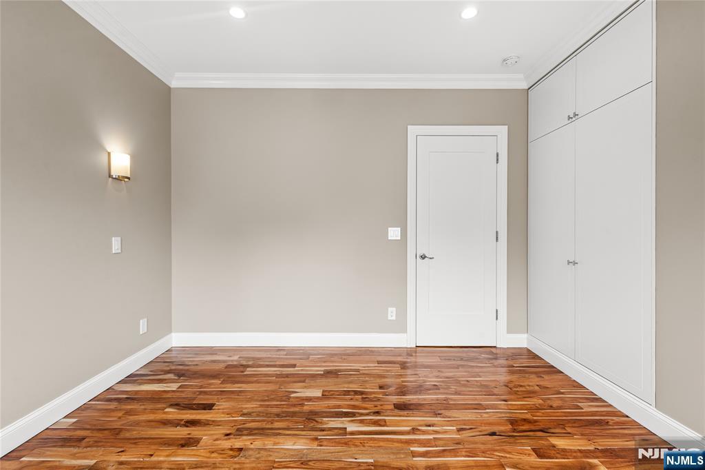 346 Cleveland Avenue, Unit 2 Hasbrouck Heights, NJ 07604 - Photo 38 of 39 a view of a room with wooden floor