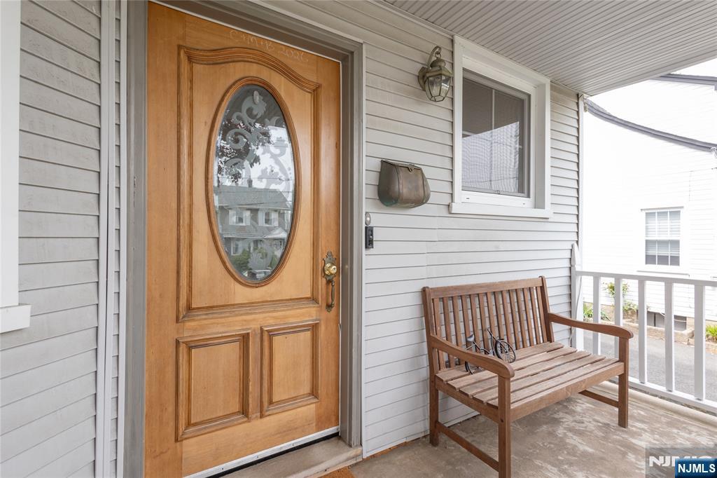 346 Cleveland Avenue, Unit 2 Hasbrouck Heights, NJ 07604 - Photo 4 of 39 a view of a door and chair in the balcony