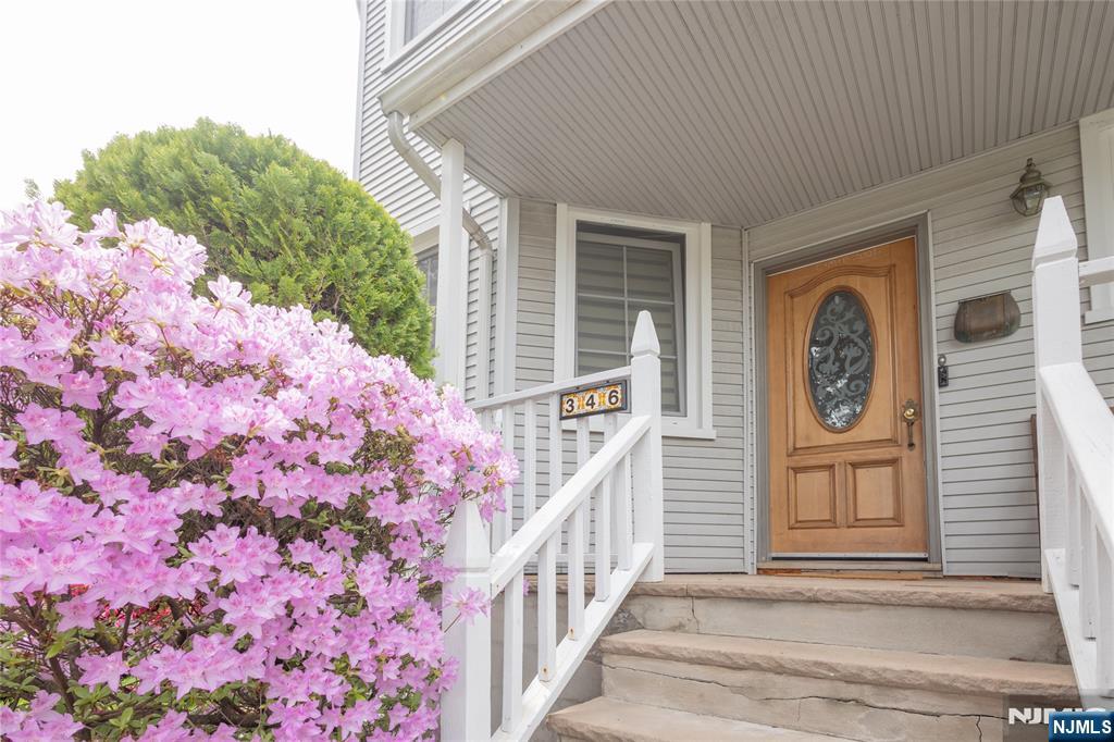 346 Cleveland Avenue, Unit 2 Hasbrouck Heights, NJ 07604 - Photo 6 of 39 a front view of a house with entryway