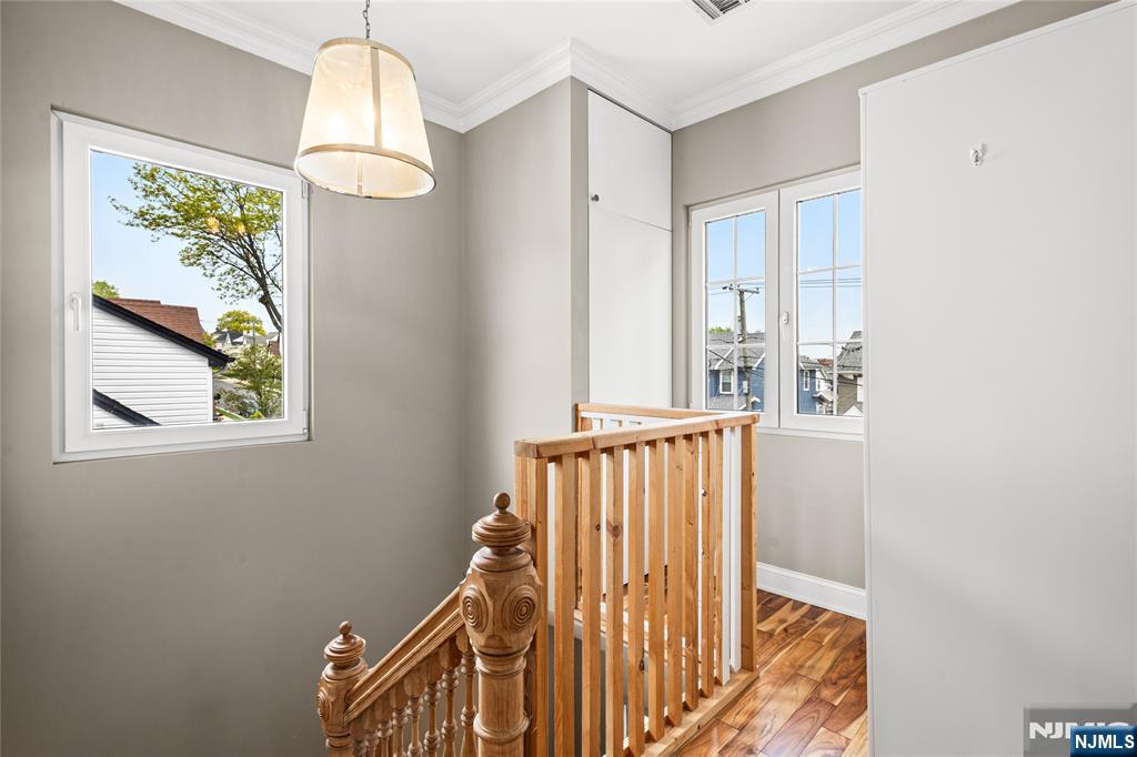 346 Cleveland Avenue, Unit 2 Hasbrouck Heights, NJ 07604 - Photo 9 of 39 a view of staircase with rug