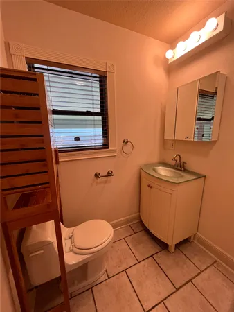 a view of a bathroom with a sink and a mirror