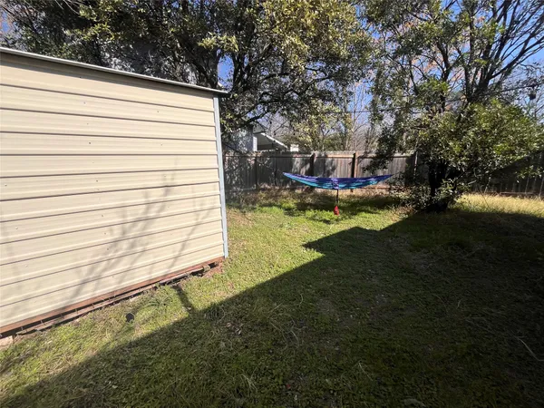 a view of swimming pool with a yard