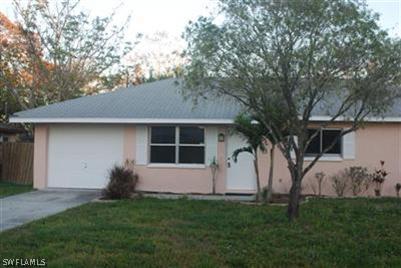 2244 Lotus Road Fort Myers, FL 33905 - Photo 1 of 6 a view of house with backyard space and garden