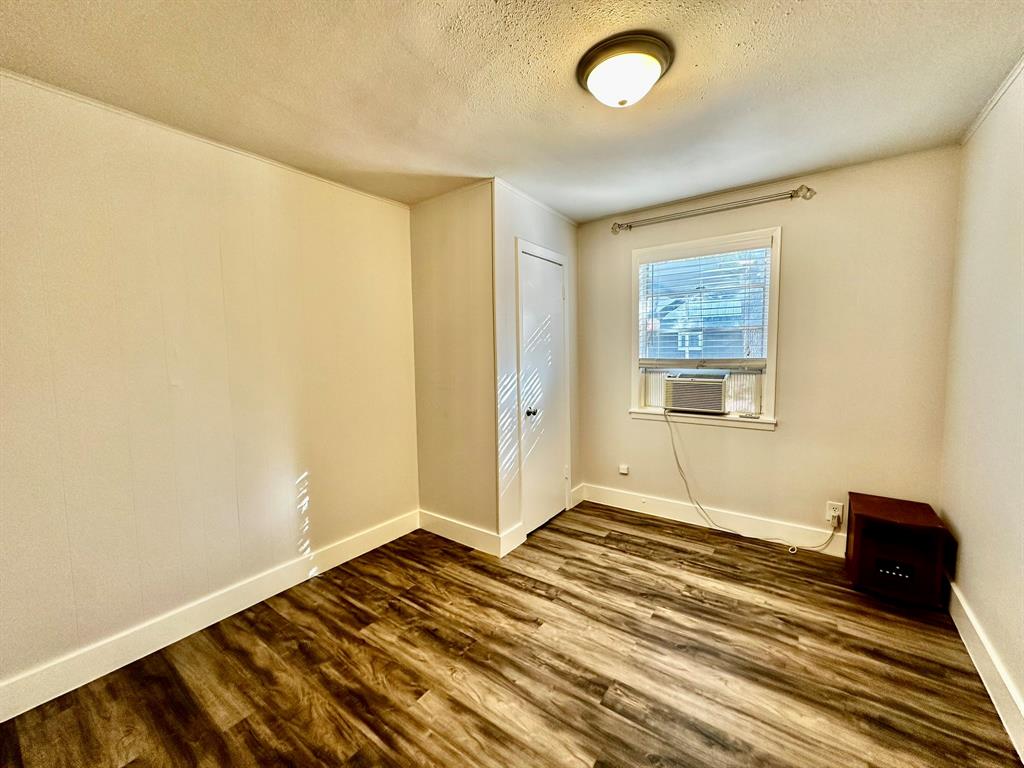 318 Windsor Drive Pottsboro, TX 75076 - Photo 14 of 18 a view of a livingroom with wooden floor and a bathroom