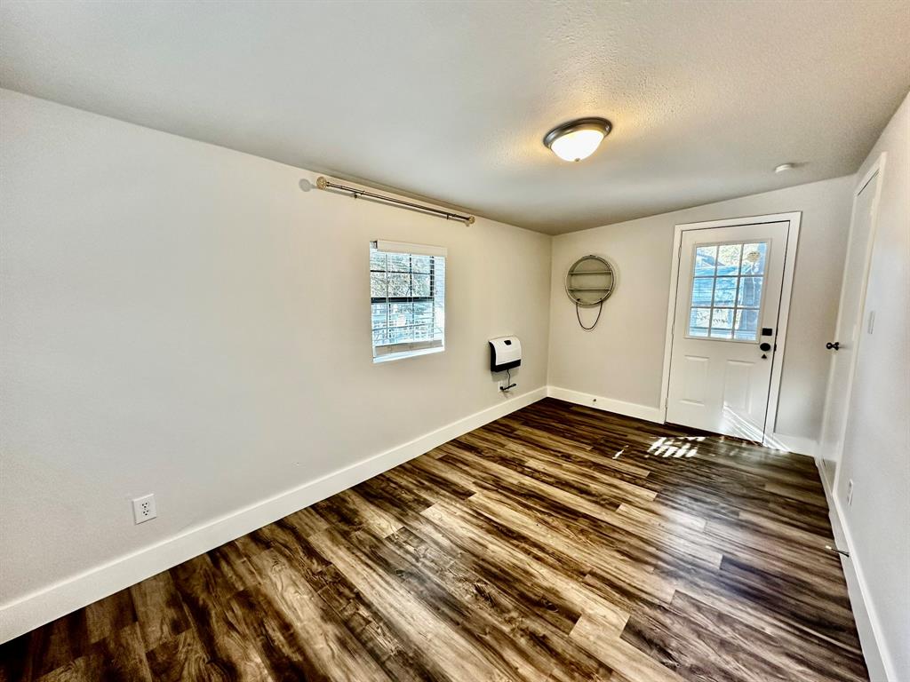 318 Windsor Drive Pottsboro, TX 75076 - Photo 16 of 18 a bedroom with a bed and a window