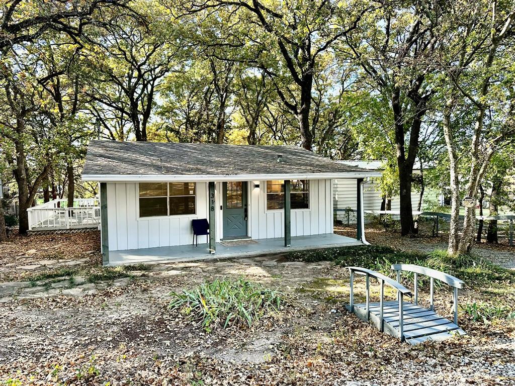 318 Windsor Drive Pottsboro, TX 75076 - Photo 17 of 18 a view of a house with a yard