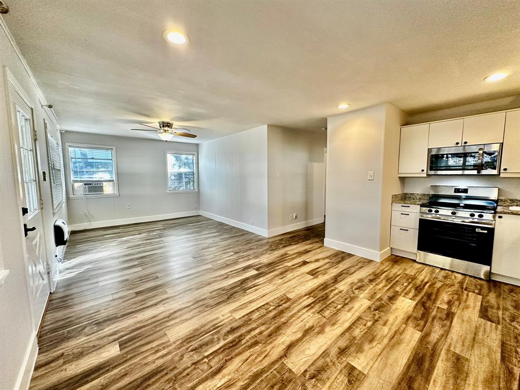 318 Windsor Drive Pottsboro, TX 75076 - Photo 18 of 18 a view of a kitchen with wooden floor and a sink