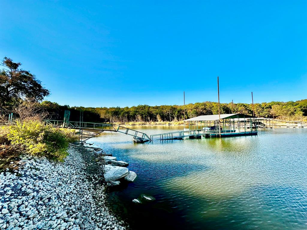 318 Windsor Drive Pottsboro, TX 75076 - Photo 7 of 18 a view of a lake with houses