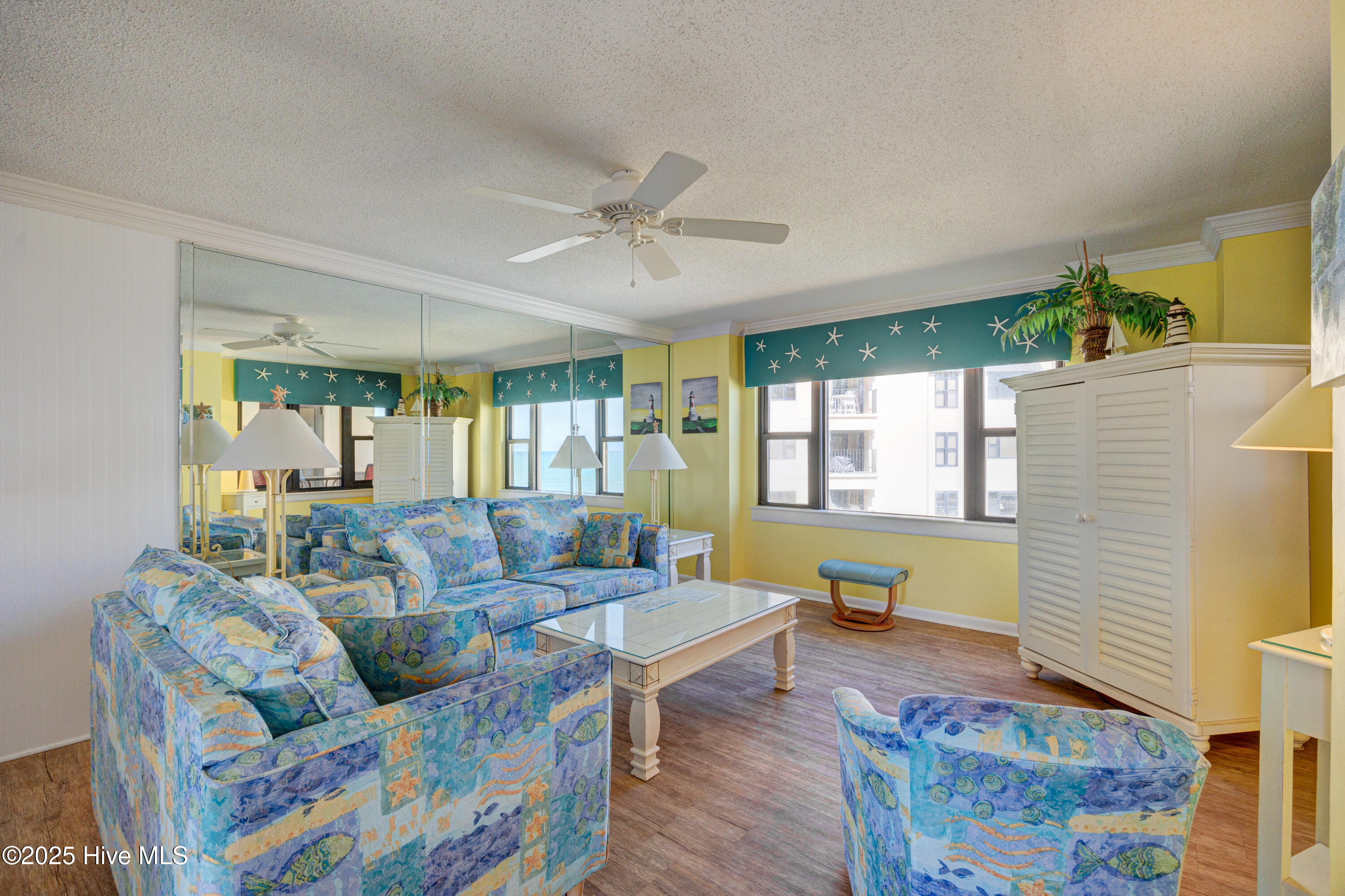1505 Salter Path Road, Unit 435 Indian Beach, NC 28512 - Photo 13 of 29 Living Room with Mirror Wall