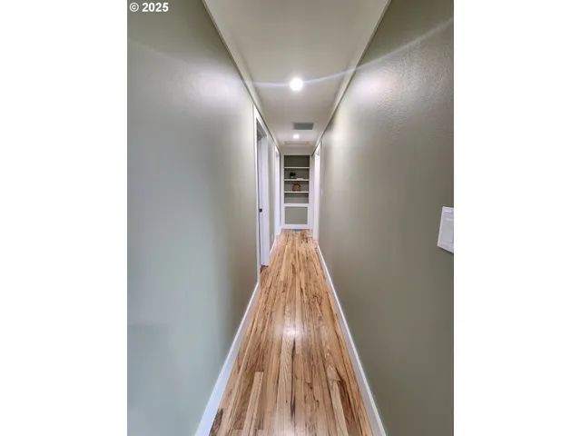 a view of a hallway with staircase