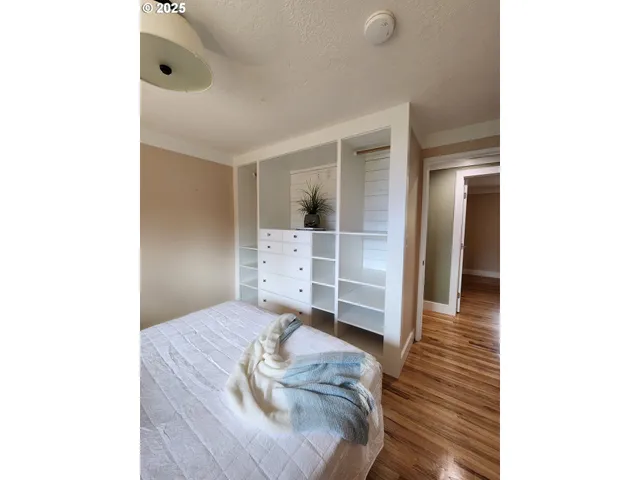 a bedroom with a bed and a view of bathroom