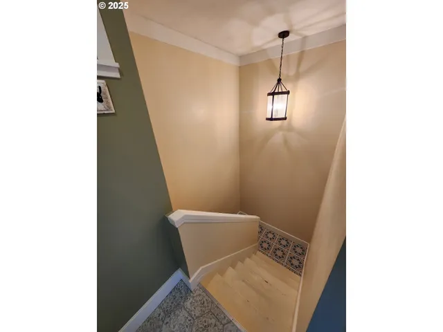 a bathroom with a toilet and a mirror