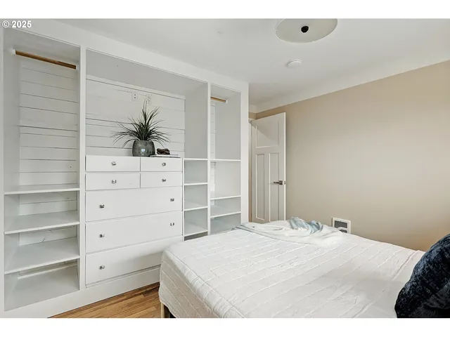 a bedroom with a bed and a cabinets
