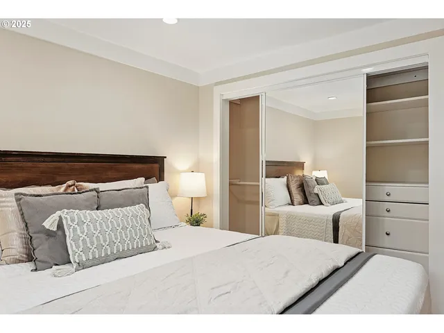 a bedroom with a bed and a cabinets