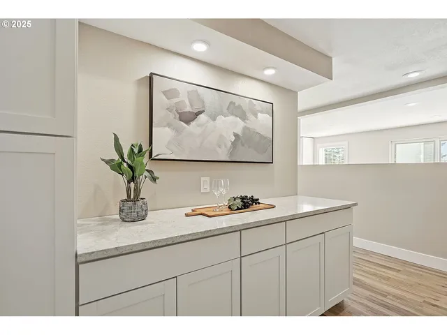 a bathroom with a sink a mirror and vanity
