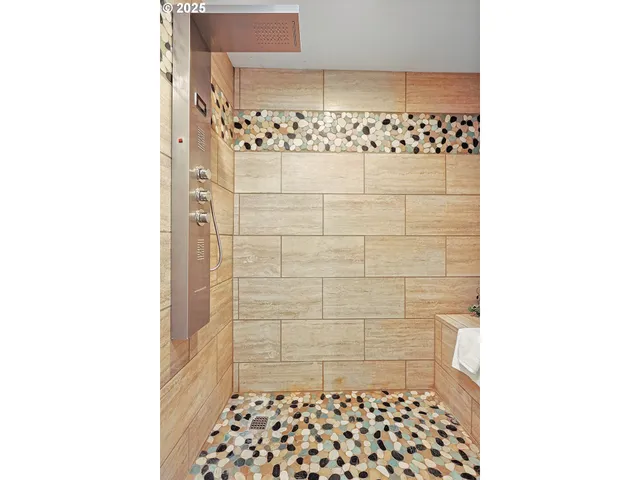 a bathroom with a shower and a sink