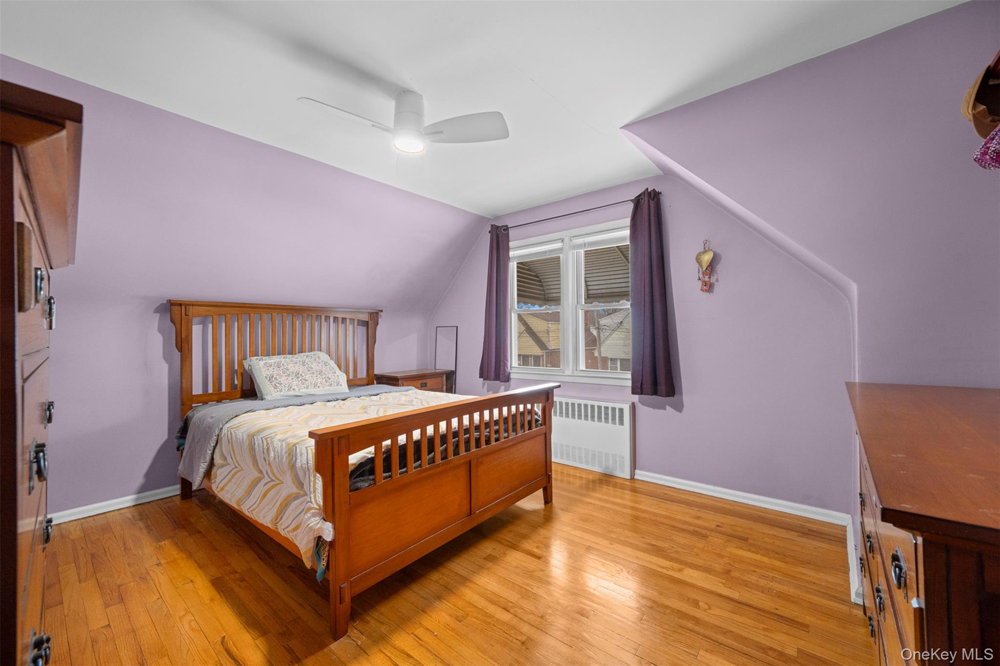 8807 Sabre Street Queens, NY 11427 - Photo 15 of 29 a bedroom with a bed and a window