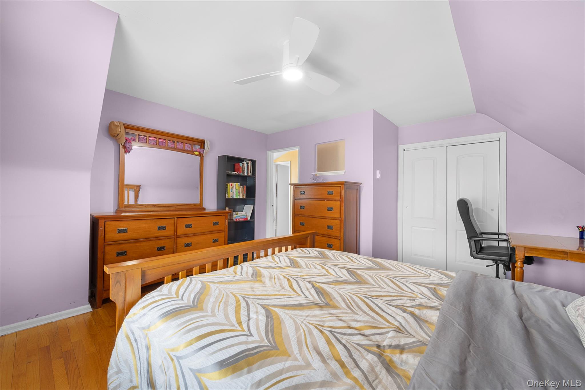 8807 Sabre Street Queens, NY 11427 - Photo 16 of 29 a bedroom with a bed and a flat screen tv