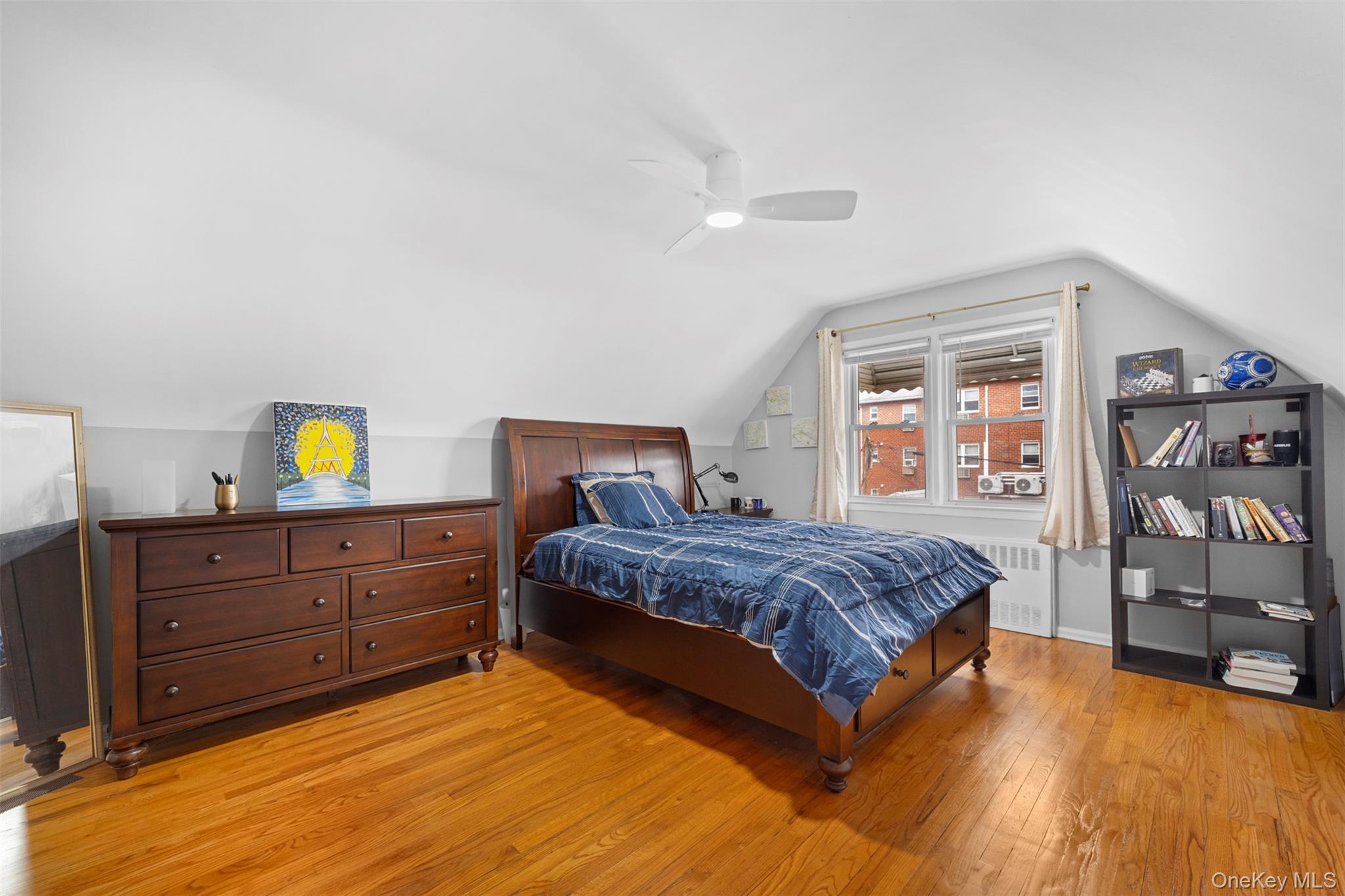 8807 Sabre Street Queens, NY 11427 - Photo 18 of 29 a bedroom with a bed and with furniture