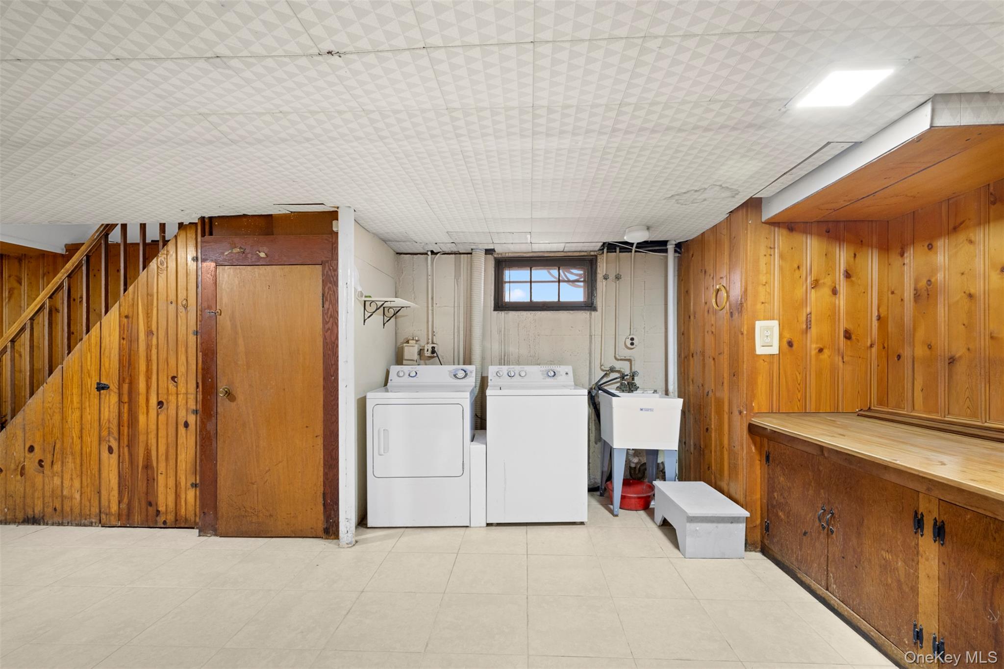 8807 Sabre Street Queens, NY 11427 - Photo 22 of 29 a utility room with dryer and washer