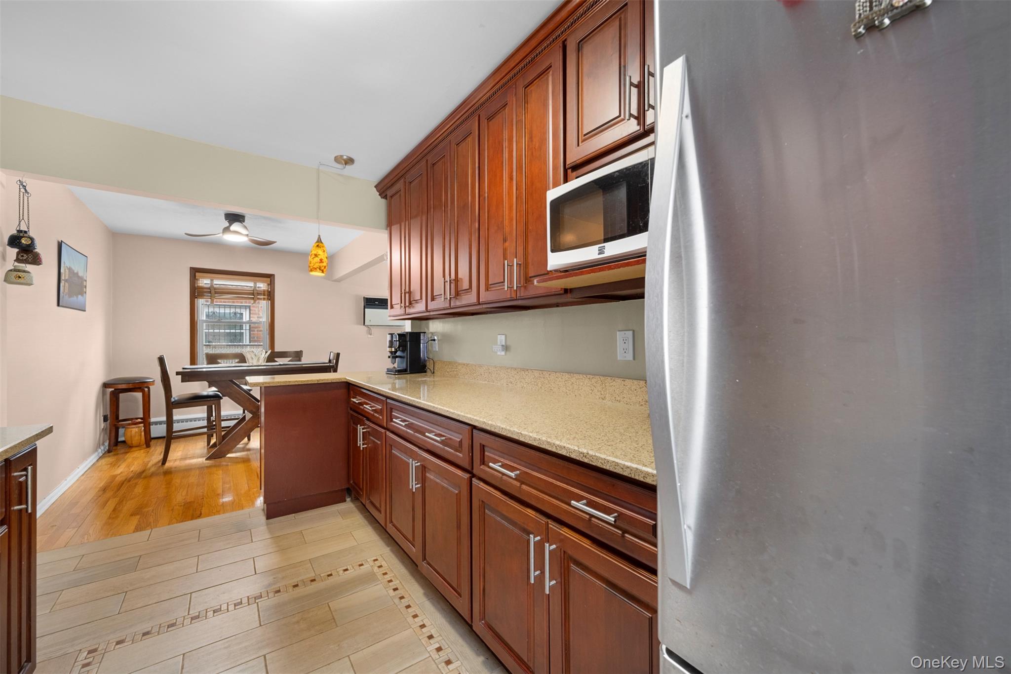 8807 Sabre Street Queens, NY 11427 - Photo 9 of 29 a kitchen with stainless steel appliances granite countertop a stove and a sink
