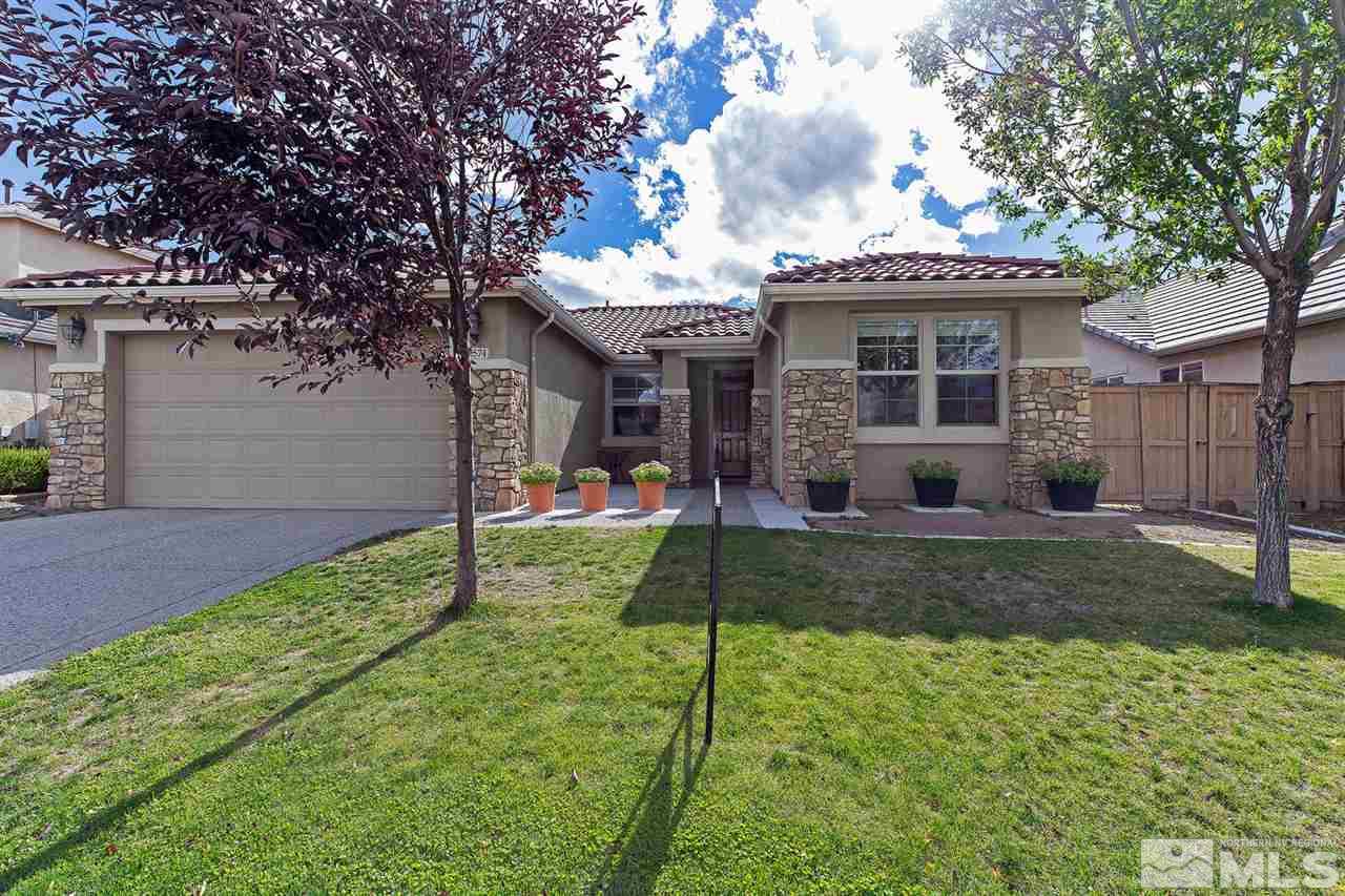 2574 Spring Flower Drive Reno, NV 89521 - Photo 1 of 1 a front view of a house with a yard and porch