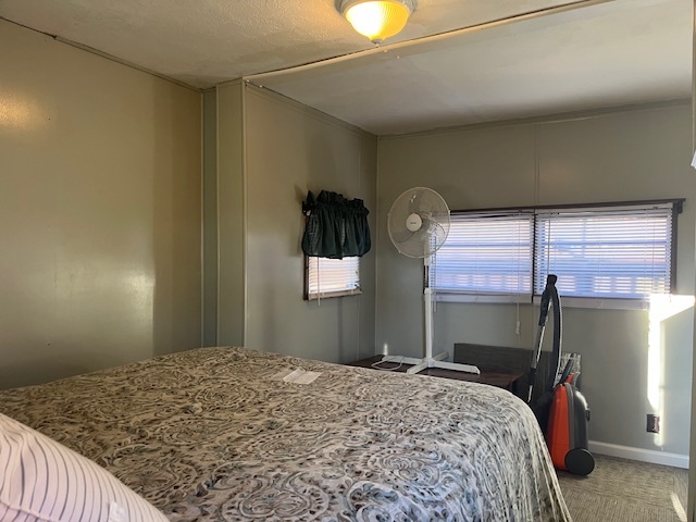 2795 East 28th Road Marseilles, IL 61341 - Photo 9 of 17 a bedroom with a bed and a chandelier