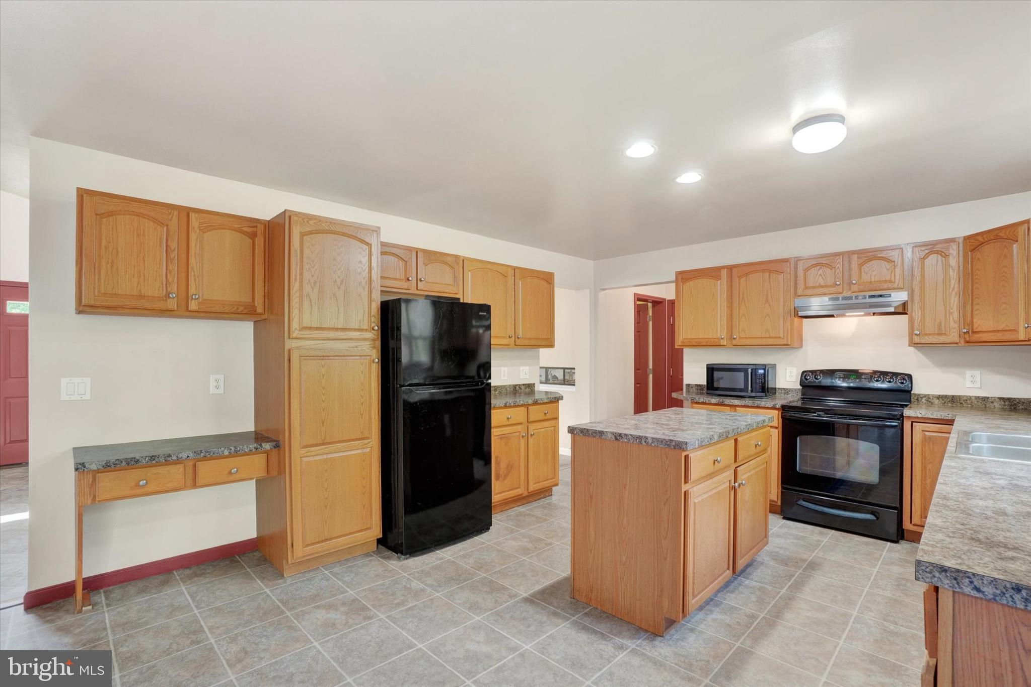 1055 Copenhaffer Road York, PA 17404 - Photo 19 of 38 a kitchen with a stove top oven and refrigerator