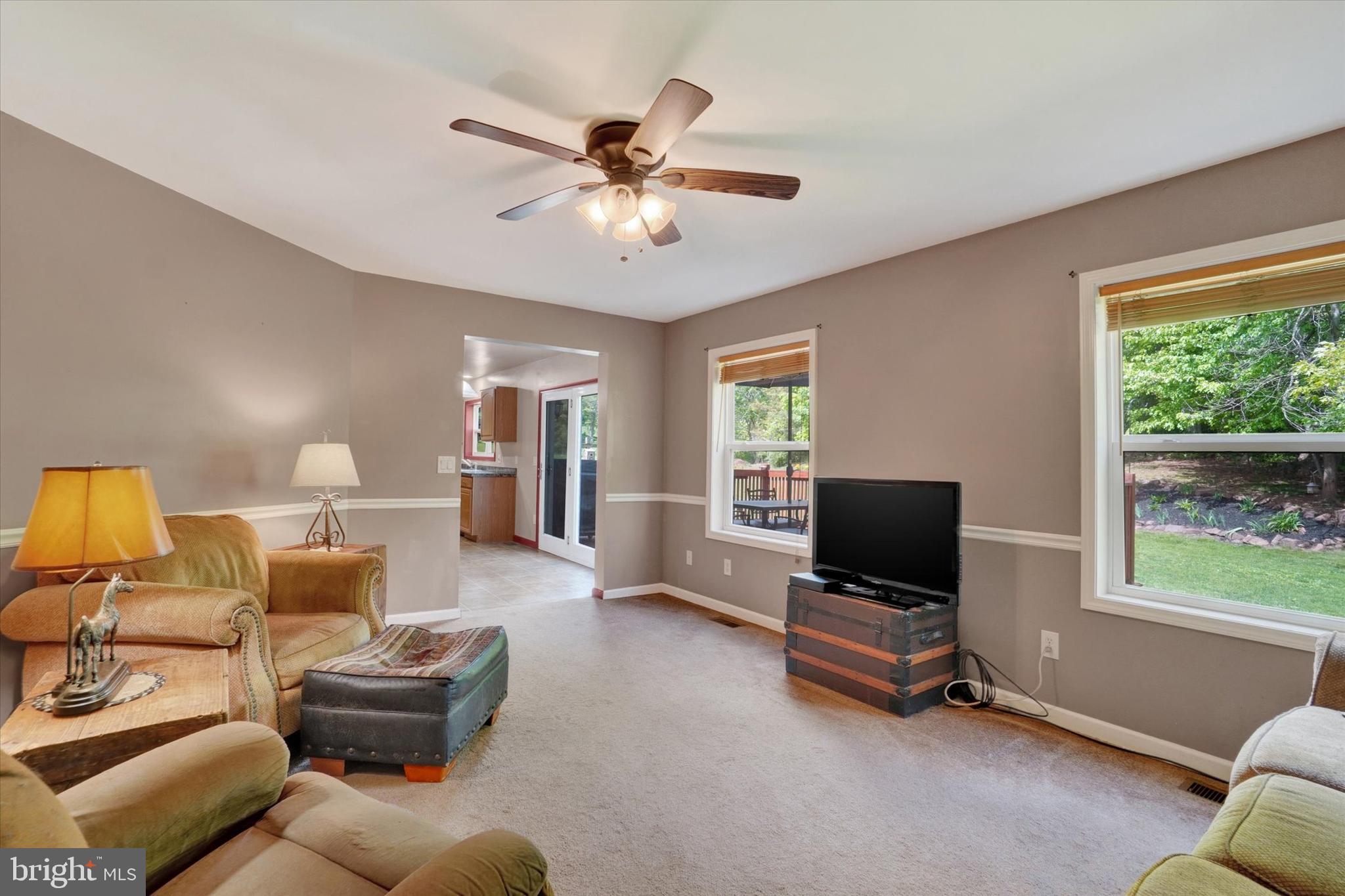 1055 Copenhaffer Road York, PA 17404 - Photo 22 of 38 a living room with furniture gym equipment and a flat screen tv