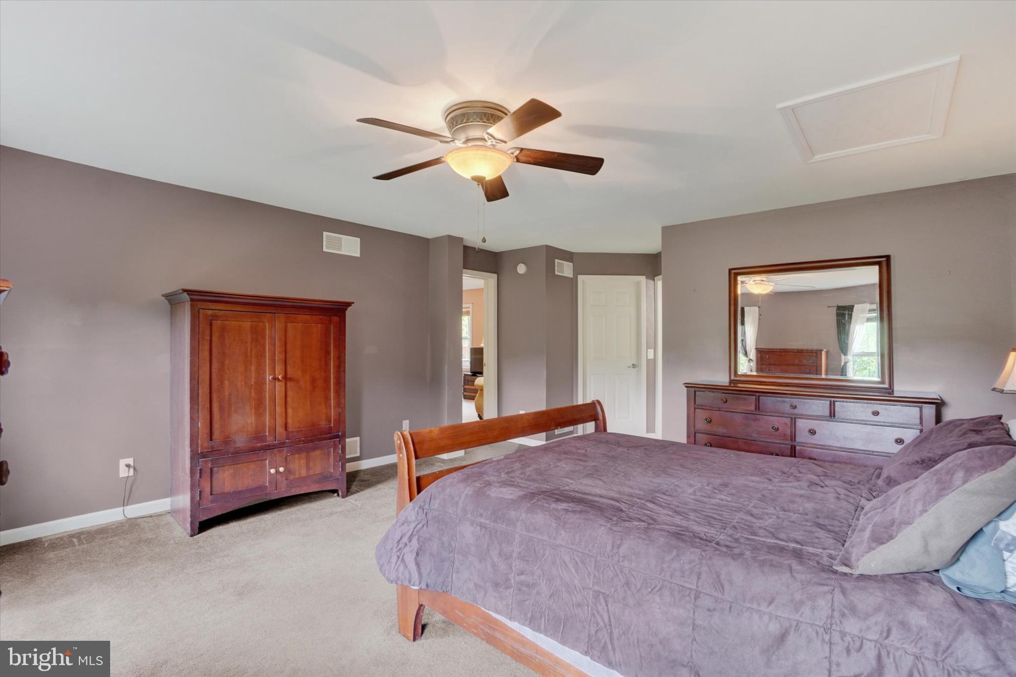 1055 Copenhaffer Road York, PA 17404 - Photo 24 of 38 a bedroom with a large bed and a chandelier