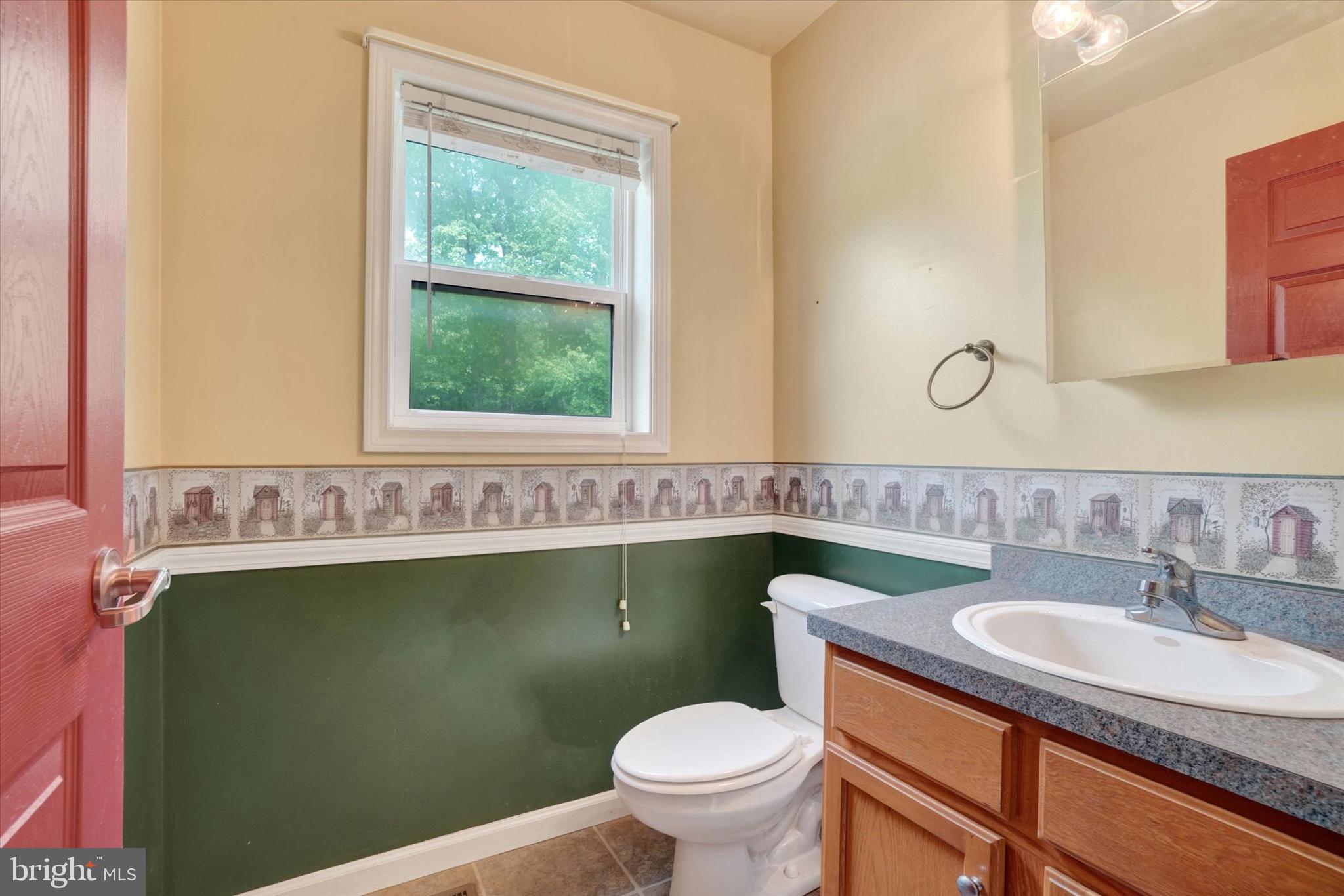 1055 Copenhaffer Road York, PA 17404 - Photo 28 of 38 a bathroom with a granite countertop toilet sink and mirror