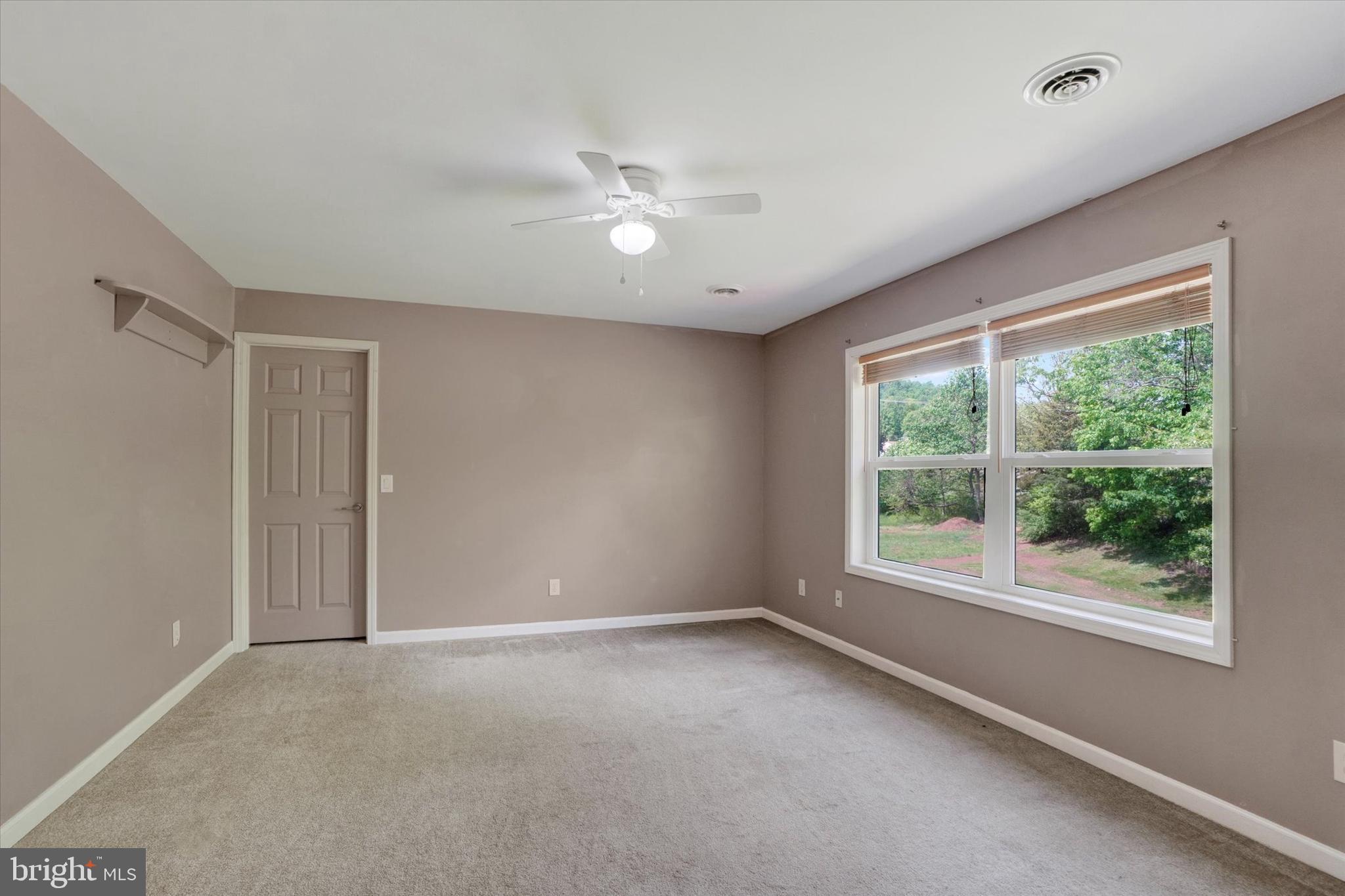 1055 Copenhaffer Road York, PA 17404 - Photo 7 of 38 a view of a livingroom with a ceiling fan and window