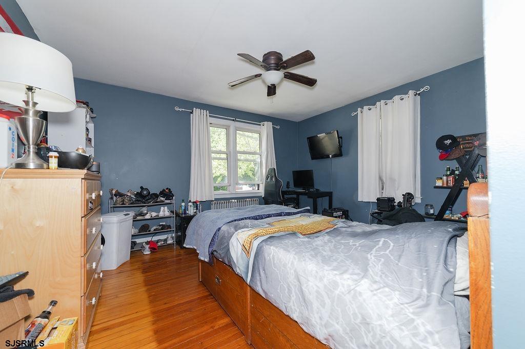 19 South 1st Road Hammonton, NJ 08037 - Photo 17 of 36 a bedroom with a bed and a large window