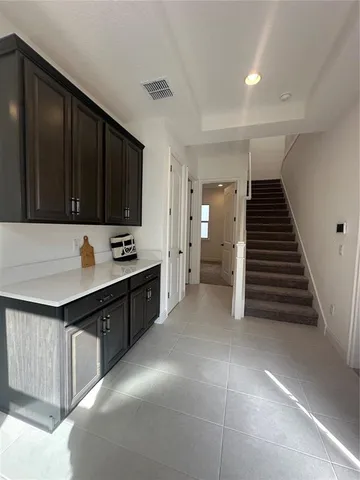 a kitchen with a cabinets and a stove top oven