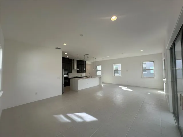 a view of a kitchen with a sink and dishwasher cabinets