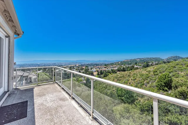 a view of balcony with furniture