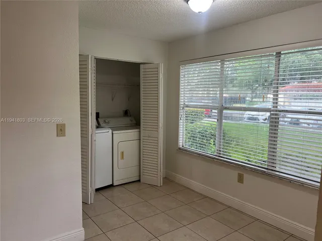 a bathroom with a bathtub and window
