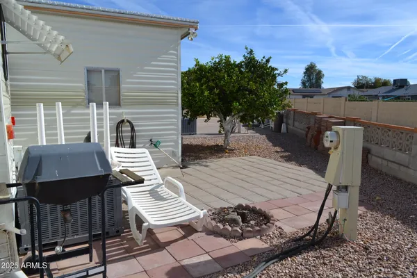 a view of a patio with wooden floor