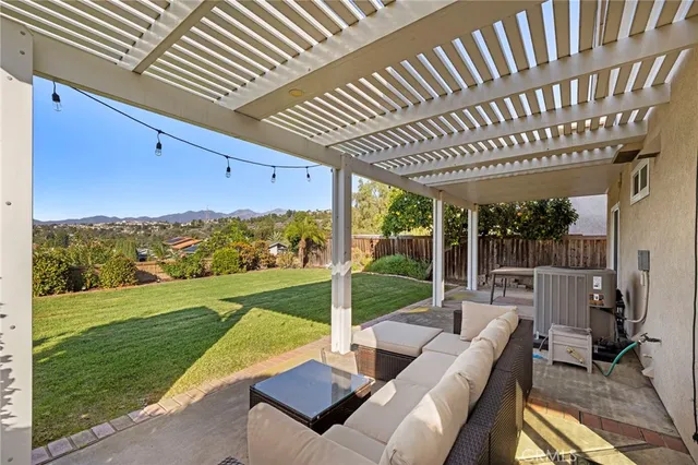 a view of yard with patio